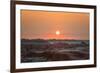 The sun setting over the landscape of hoodoos and hills of Badlands National Park.-Sheila Haddad-Framed Photographic Print