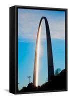 The sunset reflects on the majestic Gateway Arch, the Jefferson National Expansion Memorial, the...-null-Framed Stretched Canvas