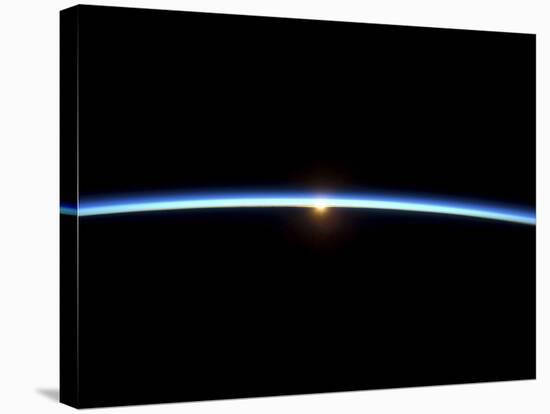 The Thin Line of Earth's Atmosphere and the Setting Sun-null-Stretched Canvas