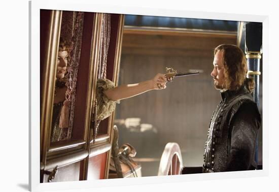 THE THREE MUSKETEERS (L-R) MILLA JOVOVICH and MATTHEW MACFADYEN star in THE THREE MUSKETEERS 3D. (p-null-Framed Photo