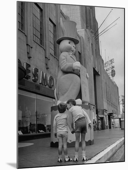 The Toll Brothers Admiring 6 Ft. Easter Bunny-Bob Landry-Mounted Photographic Print