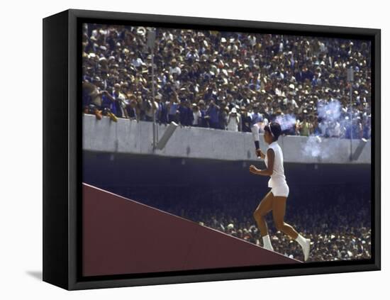 The Torch Being Carried Up the Steps in the Olympic Stadium at the Summer Olympics-John Dominis-Framed Stretched Canvas