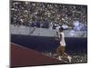The Torch Being Carried Up the Steps in the Olympic Stadium at the Summer Olympics-John Dominis-Mounted Photographic Print