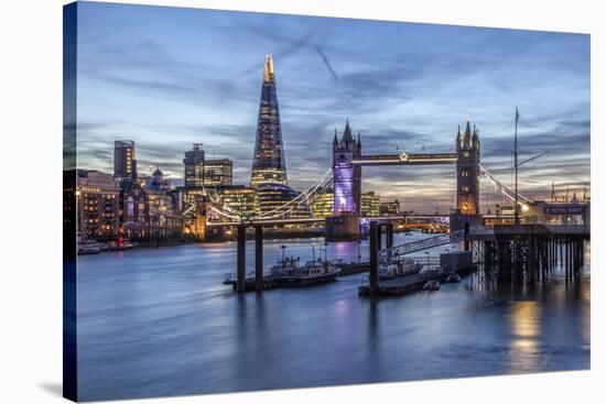 The Tower Bridge in London Seen from the East at Dusk. in the Background-David Bank-Stretched Canvas