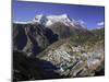 The Town of Namche Bazaar with the Kongde Ri (Kwangde Ri) Mountain Range in the Background-John Woodworth-Mounted Photographic Print