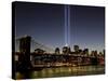 The Tribute of Light Memorial Shines into the Sky Over the Night Skyline of New York City-null-Stretched Canvas