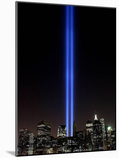 The Tribute of Light Memorial Shines into the Sky Over the Night Skyline of New York City-null-Mounted Photographic Print