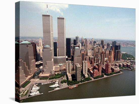 The Twin Towers of the World Trade Center Rise Above the New York Skyline-null-Stretched Canvas