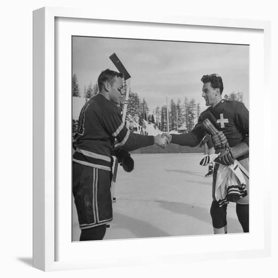 The Usa Team Giving the Swiss a Sweater and a Friendly Handshake before the Game-Mark Kauffman-Framed Premium Photographic Print