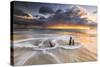 The Waves and Caribbean Sunset Frames Tree Trunks on Ffryes Beach, Antigua, Antigua and Barbuda-Roberto Moiola-Stretched Canvas