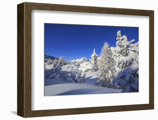 The winter sun illuminate the snowy landscape and the typical church Maloja Canton of Engadine Swit-ClickAlps-Framed Photographic Print