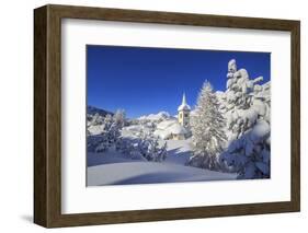 The winter sun illuminate the snowy landscape and the typical church Maloja Canton of Engadine Swit-ClickAlps-Framed Photographic Print