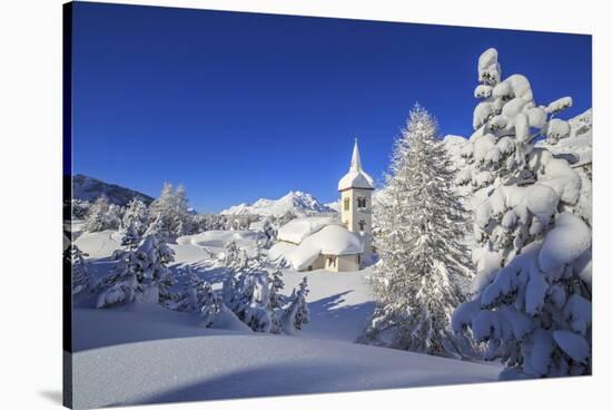 The winter sun illuminate the snowy landscape and the typical church Maloja Canton of Engadine Swit-ClickAlps-Stretched Canvas
