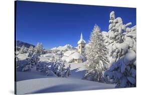 The winter sun illuminate the snowy landscape and the typical church Maloja Canton of Engadine Swit-ClickAlps-Stretched Canvas