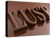 The Word Lust, Chocolate-coated-Kai Stiepel-Stretched Canvas