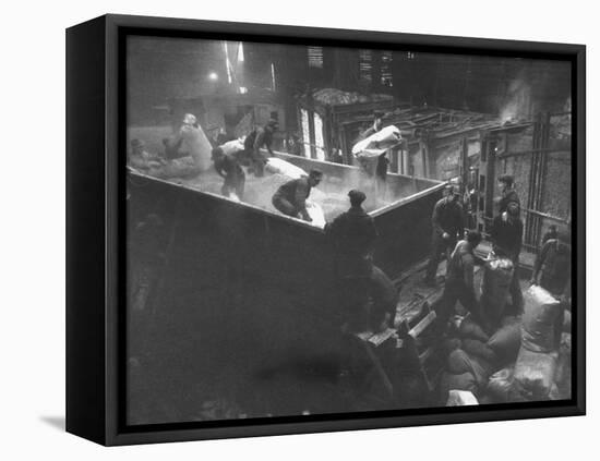 The Workmen Quickly Covering the Ingot with Vermiculite-Ralph Morse-Framed Stretched Canvas