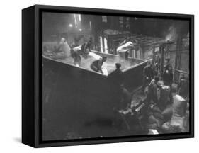 The Workmen Quickly Covering the Ingot with Vermiculite-Ralph Morse-Framed Stretched Canvas