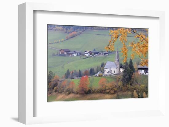 The yellow leaves of a larch frame the alpine church in the fall, St. Magdalena, Funes Valley, Sout-Roberto Moiola-Framed Photographic Print