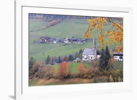 The yellow leaves of a larch frame the alpine church in the fall, St. Magdalena, Funes Valley, Sout-Roberto Moiola-Framed Photographic Print