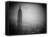 The Zeppelin Hindenburg Floats Past the Empire State Building-null-Framed Stretched Canvas