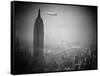 The Zeppelin Hindenburg Floats Past the Empire State Building-null-Framed Stretched Canvas