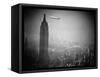 The Zeppelin Hindenburg Floats Past the Empire State Building-null-Framed Stretched Canvas