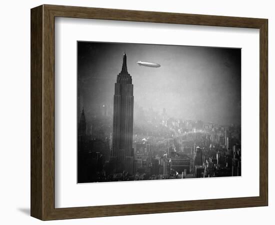 The Zeppelin Hindenburg Floats Past the Empire State Building-null-Framed Photographic Print