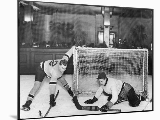 There's a Goal Mouth Scramble During This Game of Ice Hockey-null-Mounted Photographic Print