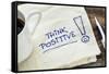 Think Positive - Motivational Slogan on a Napkin with a Cup of Coffee-PixelsAway-Framed Stretched Canvas