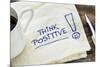 Think Positive - Motivational Slogan on a Napkin with a Cup of Coffee-PixelsAway-Mounted Photographic Print