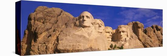 This Is a Close Up View of Mount Rushmore National Monument Against a Blue Sky-null-Stretched Canvas