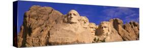 This Is a Close Up View of Mount Rushmore National Monument Against a Blue Sky-null-Stretched Canvas