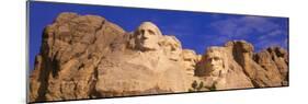This Is a Close Up View of Mount Rushmore National Monument Against a Blue Sky-null-Mounted Photographic Print