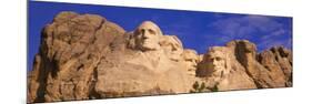 This Is a Close Up View of Mount Rushmore National Monument Against a Blue Sky-null-Mounted Photographic Print