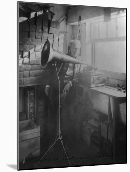 Thomas Edison Listening To The Phonograph-null-Mounted Art Print