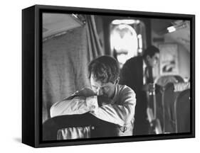 Thoughtful Senator Robert F. Kennedy on Airplane During Campaign Trip to Aid Local Candidates-Bill Eppridge-Framed Stretched Canvas