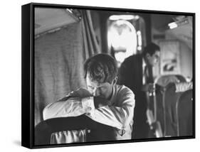 Thoughtful Senator Robert F. Kennedy on Airplane During Campaign Trip to Aid Local Candidates-Bill Eppridge-Framed Stretched Canvas