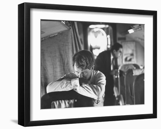 Thoughtful Senator Robert F. Kennedy on Airplane During Campaign Trip to Aid Local Candidates-Bill Eppridge-Framed Photographic Print