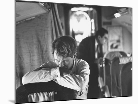 Thoughtful Senator Robert F. Kennedy on Airplane During Campaign Trip to Aid Local Candidates-Bill Eppridge-Mounted Photographic Print