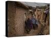 Three Afghan Refugee Women and their Children Walk in an Alley of a Poor Neighborhood in Pakistan-null-Stretched Canvas