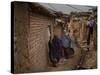 Three Afghan Refugee Women and their Children Walk in an Alley of a Poor Neighborhood in Pakistan-null-Stretched Canvas