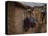 Three Afghan Refugee Women and their Children Walk in an Alley of a Poor Neighborhood in Pakistan-null-Stretched Canvas