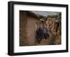 Three Afghan Refugee Women and their Children Walk in an Alley of a Poor Neighborhood in Pakistan-null-Framed Photographic Print