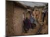 Three Afghan Refugee Women and their Children Walk in an Alley of a Poor Neighborhood in Pakistan-null-Mounted Photographic Print