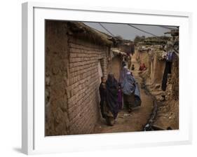 Three Afghan Refugee Women and their Children Walk in an Alley of a Poor Neighborhood in Pakistan-null-Framed Photographic Print