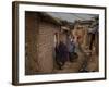 Three Afghan Refugee Women and their Children Walk in an Alley of a Poor Neighborhood in Pakistan-null-Framed Photographic Print