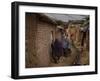 Three Afghan Refugee Women and their Children Walk in an Alley of a Poor Neighborhood in Pakistan-null-Framed Photographic Print