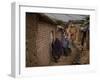 Three Afghan Refugee Women and their Children Walk in an Alley of a Poor Neighborhood in Pakistan-null-Framed Photographic Print