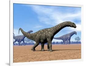 Three Argentinosaurus Dinosaurs Walking in the Desert-null-Framed Art Print