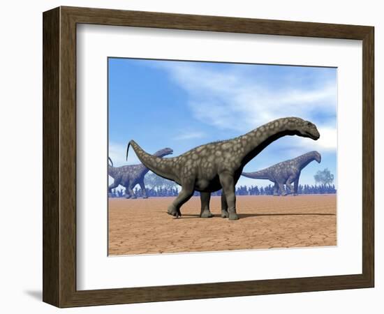 Three Argentinosaurus Dinosaurs Walking in the Desert-null-Framed Art Print